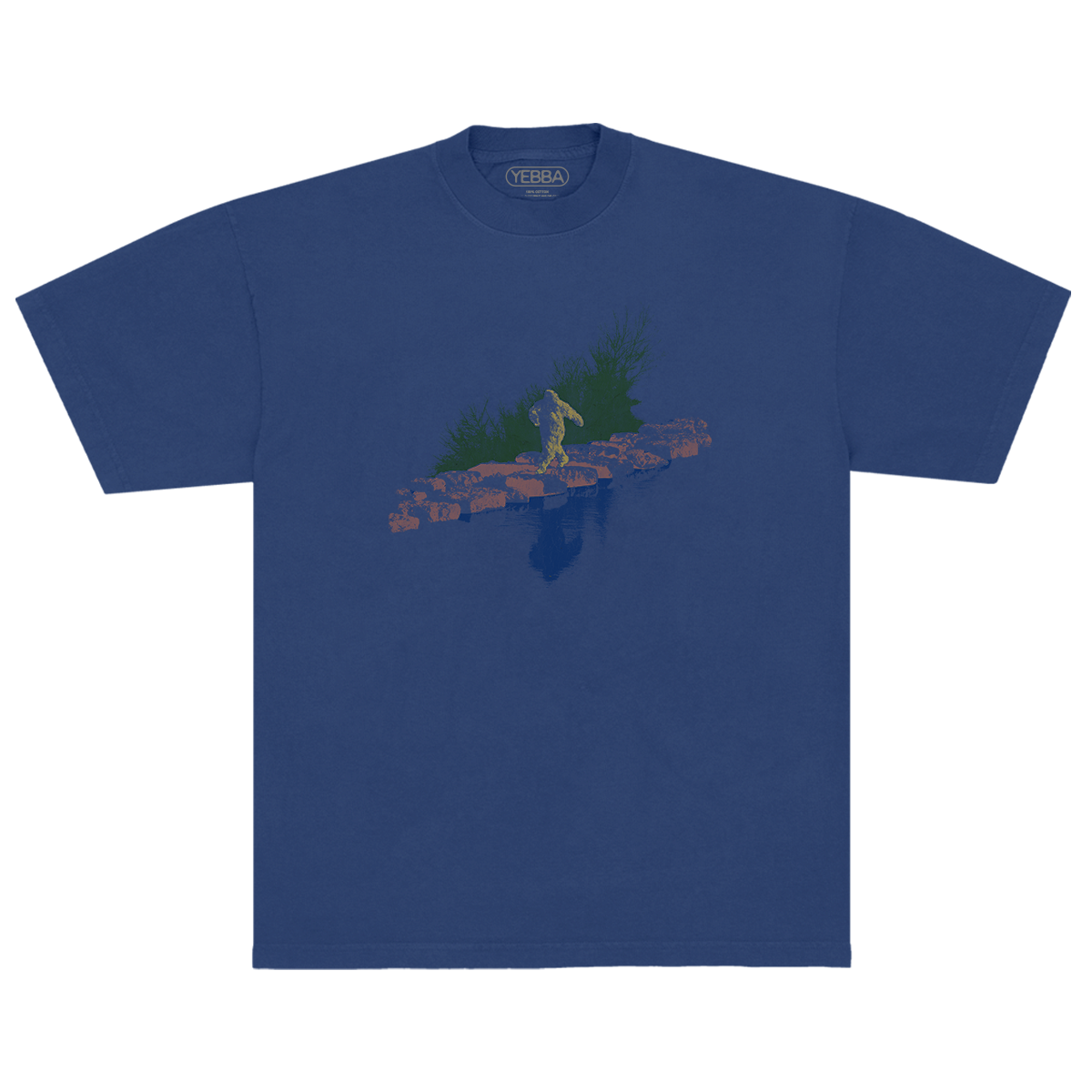 Blue t-shirt with a graphic design of a Sasquatch walking on rocks with grass behind it and a water refection in front.